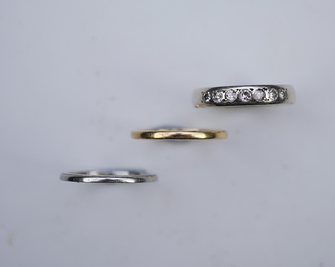 A diamond ring and two gold wedding rings
